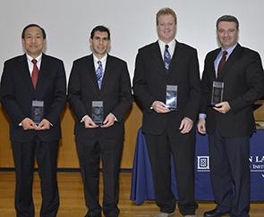 The 2012 MIT Lincoln Laboratory Best Invention trophies were awarded to (left to right) Dr. Michael Vai, Dr. Joshua Kramer, Dr. David Whelihan, and Dr. Roger Khazan. 