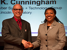 Robert Cunningham is congratulated on his Bringing Out the Best Award by MIT Vice President for Human Resources Lorraine Goffe-Rush