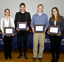 Shown with their Best Paper Award plaques are some of the authors of "Broadband Magnetometry and Temperature Sensing with a Light-Trapping Diamond Waveguide": from left to right, Danielle Braje, Tim Schröder, Matthew Trusheim, and Hannah Clevenson. Unable to attend the awards ceremony were Carson Teale and Dirk Englund. 