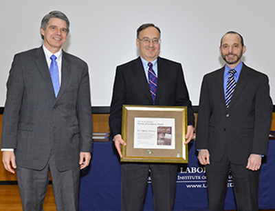 Dr. Clifford Weinstein (center) was presented a 2012 Technical Excellence Award by MIT Lincoln Laboratory Director Eric Evans (left) and was introduced by Dr. Marc Zissman (right), associate head of the Cyber Security and Information Sciences Division